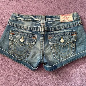 TRUE RELIGION , low-cut denim shorts. Women’s waist 27.